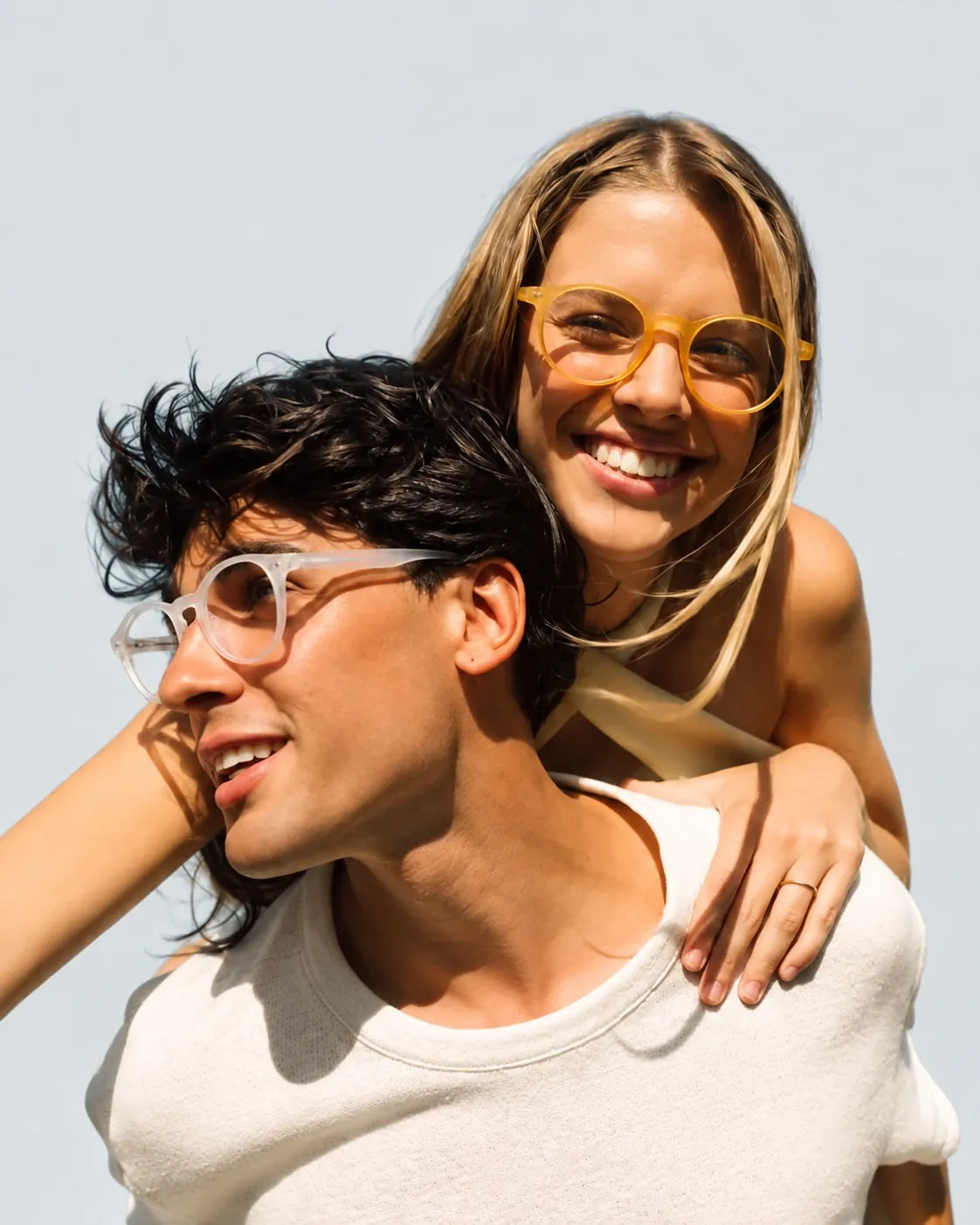 Couple in round glasses, piggyback